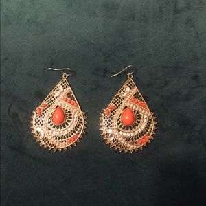 Gold and orange stone earrings.